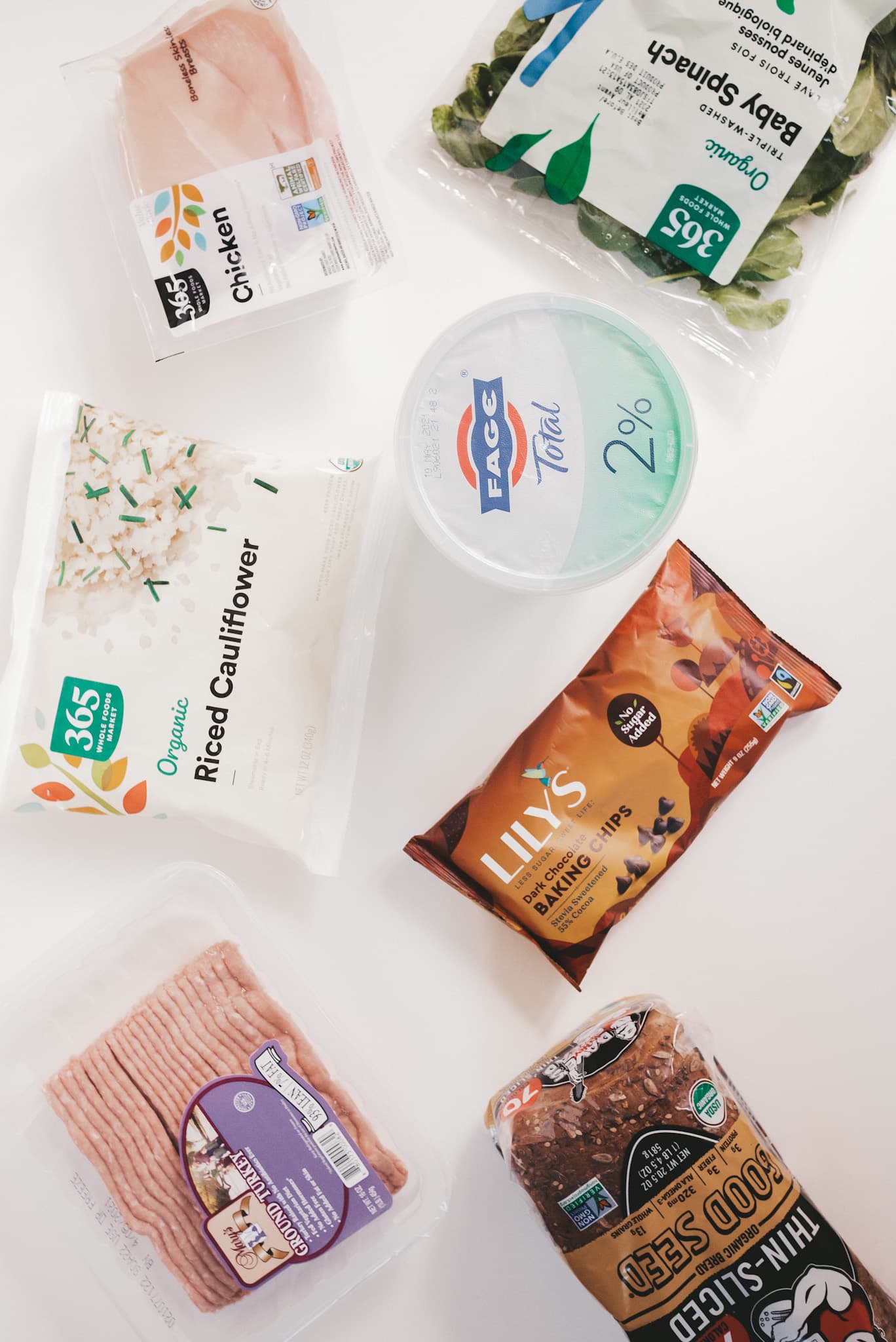 an assortment of grocery products on a white background