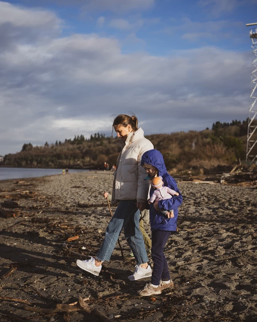 Walking on the beach with a child, casual winter outfit