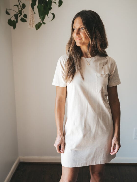 ashley wearing a cream colored t-shirt dress